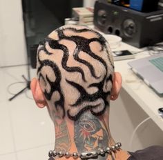 a man with a tattoo on his head