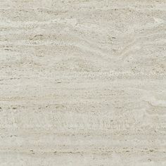 a close up view of a white marble textured wall or floor tile with light brown streaks