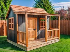 a small wooden shed sitting on top of a lush green field