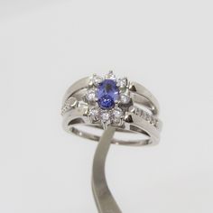 Vintage Sterling Silver Two Side Tanzanite & Rainbow Topaz Cluster Ring ....Marked 925...Total of weights 7.9gramsMeasure of Face 11.5MM...It's in very good condition. Silver Tanzanite Multi-stone Rings, Silver Tanzanite Hallmarked Rings, Silver Tanzanite Ring With Brilliant Cut, Silver Tanzanite Ring With Center Stone, Topas Ring, Rainbow Topaz, One Ring, 1980s Vintage, Cluster Ring