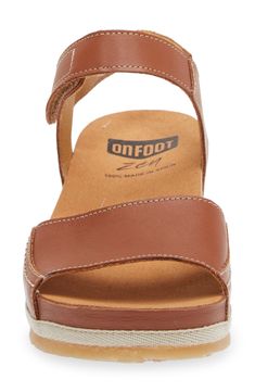 A leather-wrapped platform raises this sandal that offers total comfort with a contoured footbed that targets pressure points to relieve tension and stress. 1 1/2" heel; 1/2"platform (size 39) Adjustable hook-and-loop strap Zen footbed massages pressure points as you walk to relieve stress in the muscles and increase circulation Leather upper/synthetic lining and sole Made in Spain Women's Shoes Leather Footbed Sandals With Arch Support And Wedge Heel, Massage Pressure Points, Increase Circulation, Earth Shoes, Pressure Points, Leather Shoes Woman, Shoes Woman, Platform Sandals, Leather Shoes