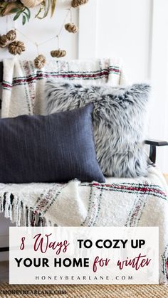 pillows and blankets on a chair with text overlay that reads 3 ways to cozy up your home for winter