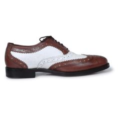 Looking for something that speaks classy? These dual toned oxford shoes should be the perfect fit for your taste. Manufactured using high- quality genuine leather; these pair of shoes carry a distinctive brogue wing-tip design perfect for flaunting at any formal event such as weddings or business gatherings. This product undoubtedly reflects its worth with the unique color contrast of rich coffee brown & white along with its specific finesse and detailed designing on the border of the shoes. The inner soles of the shoes are also lined with leather making for a comfortable, cozy fit throughout the day. Some features of the product that highlight its worth include: Use of premium leather Unique color combination of coffee and white Fashionable brogue wing-tip design Leather padding on the in White Brogue Oxford Shoes With Pointed Toe, White Brogue Dress Shoes For Business, White Wingtip Oxfords For Office, White Wingtip Dress Shoes For Office, Formal White Dress Shoes With Brogue Detailing, White Brogue Dress Shoes For Formal Occasions, White Dress Shoes With Brogue Detailing For Formal Occasions, White Wingtip Oxfords With Brogue Detailing, White Wingtip Lace-up Shoes For Business