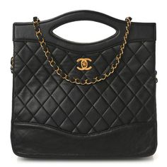 This is an authentic CHANEL Lambskin Quilted 31 Shopping Bag in Black. This stylish tote is crafted of padded diamond quilted lambskin leather in black with smooth leather trim in black. The bag features black handles, a long black rolled shoulder strap, and a gold Chanel CC turn lock. The top is open to a burgundy leather interior with zipper pockets. Formal Quilted Tote Shoulder Bag, Elegant Quilted Business Bag, Quilted Leather Evening Bag, Quilted Leather Business Bag, Business Leather Quilted Bag, High-end Black Quilted Bag, High-end Quilted Bags For Formal Occasions, High-end Quilted Formal Bag, High-end Formal Quilted Bags