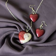 Two-Toned Heart Earring and Pendant Set...Silver plated.  Pendant is Two-Toned White & Burgundy, Earrings are a matching Burgundy ONLY 1 Unique set like this! Heart-shaped Jewelry For Gifts, Nickel-free Heart Pendant Earrings For Gift, Handmade Heart-shaped Earrings For Gifts, Handmade Heart Cut Earrings As Gift, Handmade Heart Cut Earrings For Gifts, Valentine's Day Heart Earrings For Jewelry Making, Valentine's Day Heart Pendant Earrings Gift, Heart Beads Pendant Earrings As A Gift, Heart Beads Open Heart Earrings For Gift