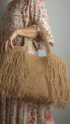 Large natural Beige Crochet Raffia Shopper bag with tassels,Shoulder Bag for the Beach or as a Chic Market bag in🌴🛍️ This listing is for pre-order. The colors I am currently posting are in the production process, and the bags will be shipped within 2 weeks. Please consider this when making your purchase. Thank you very much.🫠 This spacious bag crafted from raffia can accommodate all your essentials and doubles as a chic beach tote. Fully lined with a zippered pocket inside for storing your valuables, it offers both practicality and style. Fold the sides inward to transform it into a triangular shape for a smaller carrying option. Being made from raffia, it's incredibly lightweight and easy to clean with a damp cloth. Elevate your look with this versatile piece that combines functionalit Summer Rectangular Shoulder Bag With Fringe, Casual Rectangular Bag With Fringe, Casual Rectangular Fringed Shoulder Bag, Tasseled Straw Shoulder Bag, Summer Rectangular Bags With Tassels, Beige Tasseled Bags For Travel, Summer Fringe Rectangular Bag, Beige Travel Bag With Tassels, Summer Fringe Rectangular Bags