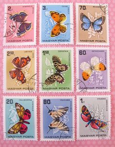 stamps with butterflies on them are displayed in different colors and sizes, including blue, pink, green, yellow