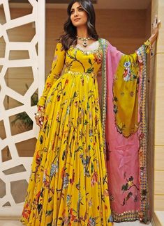 Features a mustard yellow printed Anarkali adorned with mirror detail and features a gorgeous deep back. Teamed with a contrasting blue and pink organza dupatta. Composition : Anarkali- Georgette and Shantoon, Dupatta -Organza Care: Dry Clean Only and Vacuum Storage This product can be customised for sleeves, length of blouse and neckline Delivery : 4-6 weeks as the product is hand crafted. Check Size Guide or choose MySize for free customisation (All Sizes above XL can be made at 15% additional cost) For more information and sizes please contact fabiliciousfashion@gmail.com or visit our Copenhagen studio.About the Designer : Mahima Mahajan is best known for elegant, fashionable and functional ethnic-wear. She designs phenomenal wedding wear like lehenga style sarees, bridal lehenga, India Mahima Mahajan, Yellow Anarkali, Lehenga Style Saree, Indian Bridesmaid Dresses, Printed Anarkali, Yellow Gown, Anarkali Dress Pattern, Printed Gowns, Anarkali Gown