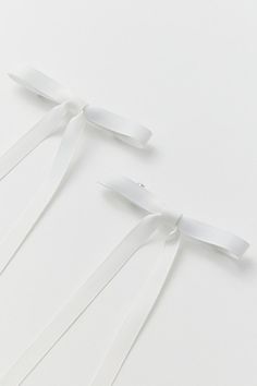 Delicate hair bows in soft grosgrain ribbon complete with a barrette backing. Set of two - wear them together or on their own for a coquette cool look. Features Ribbon hair bow barrette set Long, flowy hair bows Set of sleek secure barrette backing Set of two hair bows Content + Care Set of 2 Polyester, mixed metal Spot clean Imported | Ribbon Hair Bow Barrette Set in White, Women's at Urban Outfitters Long Flowy Hair, Flowy Hair, White Hair Bow, White Hair Bows, Bow Barrette, Hair Bow Sets, Ribbon Hair Bows, Ribbon Hair, Bow Set