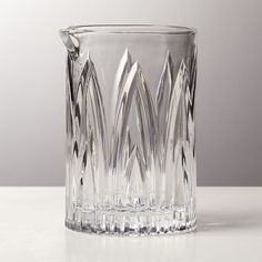 a clear glass vase sitting on top of a table