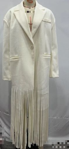 Winter Long Sleeve Outerwear With Tassels, Winter Outerwear With Tassels And Long Sleeves, Chic Winter Fringe Outerwear, Beige Tasseled Outerwear For Spring, Beige Tasseled Spring Outerwear, Elegant Winter Outerwear With Tassels, Winter Fringe Outerwear, Long Fall Outerwear With Tassels, Fringe Long Sleeve Outerwear For Winter