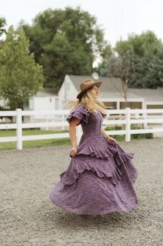 Effortless elegance comes to mind when thinking about our dreamy Solana Dress. Now available in a stunning purple lace. The adjustable corset tie on the bodice provides a personalized fit, while the short flutter sleeves add a touch of femininity. Featuring a square neckline, dazzling purple lace burnout fabric, hidden back zipper and maxi-length ruffle tiered skirt. fall aesthetic, pinterset outfit, fall outfit, family photos, country aesthetic, equestrian, lace dress, mommy & me Purple Lace Dress With Ruffles, Purple Lace Dresses With Ruffles, Feminine Purple Dress With Fitted Bodice, Purple Fitted Tiered Dress, Fitted Lavender Dress With Ruffle Hem, Fitted Purple Dress With Ruffle Hem, Purple Fitted Dress With Flutter Sleeves, Fitted Purple Dress With Flutter Sleeves, Fitted Purple Dresses With Flutter Sleeves