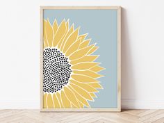 a sunflower on a blue and yellow background is featured in this modern art print