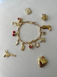 *PLEASE LIST ALL CHARM NUMBERS AND CHAIN NUMBER IN PERSONALIZATION SECTION Care: To care for your bracelet, avoid wearing it in the shower, pool, or ocean as excess exposure to moisture may cause elements of the jewelry to tarnish or degrade. xoxo Cheap Sentimental Charm Bracelet As Personalized Gift, Cheap Vintage Charm Bracelet Gift, Personalized Charm Bracelet For Friendship, Luxury Dangling Charms Bracelet, Cheap Vintage Gold Charm Bracelet, Vintage Gold Charm Bracelet Luxury, Luxury Vintage Gold Charm Bracelet, Charm Necklace Diy, Custom Charm Bracelet