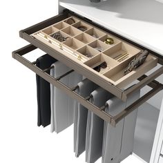 an open drawer in the middle of a desk with files and folders on it