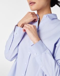 The classic button-down just got a whole lot more luxurious. Crafted from premium cotton with a super-fine yarn count, this lightweight yet durable fabric is perfect for year-round wear. Plus, it’s machine washable for easy maintenance. Designed with an oversized fit and high-low shirttail hem for the perfect amount of coverage, it looks great whether tucked or untucked. Pair it with any of our pants to instantly elevate your look. | Spanx Women's Poplin Oversized Button-Down Top Poplin Button-up Shirt With Buttons, Spring Relaxed Fit Dress Shirt With Button Cuffs, Spring Poplin Shirt With Button Closure, Spring Button-up Dress Shirt With Button Cuffs, Poplin Shirt With Button Closure For Daywear, Spring Workwear Dress Shirt, Spring Dress Shirt With Button Cuffs For Work, Spring Dress Shirt With Button Cuffs, Spring Dress Shirt With Placket For Daywear