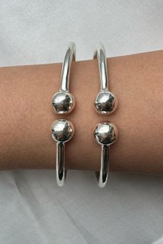 Discover timeless elegance with our .925 Sterling Silver Plain West Indian Bangles. Each bangle is a testament to refined simplicity, handcrafted in the USA to adorn your wrists with a touch of luxe. ✨ With a heavy and thick yet elegant plain design, these ball silver bangles are meant for those who appreciate the true beauty of handmade jewelry. 🌟 Elevate your style with our solid silver pieces that whisper sophistication!
Explore our exquisite Sterling Silver Bangles Collection for an addition to your jewelry ensemble that resonates with elegance and pride. 💫
#BangleBracelets #silverbangles #westindianbangles #westindystyles Bangles Collection, West Indian Bangles, West Indies Style, Indian Bangles, Plain Design, Sterling Silver Bangles, Silver Pieces, Silver Bangles, True Beauty