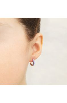 Easy-to-wear hoop earrings will add significant polish to even your most casual ensembles. 1/2" drop; 1/8" width Hinge with snap-post closure Sterling silver with goldtone plate/enamel Imported Everyday Single Enamel Earring, Trendy Enamel Earrings For Everyday, Everyday Enamel Hoop Earrings, Hypoallergenic Enamel Jewelry For Everyday, Hoop Huggie Earrings In Enamel, Small Hoop Enamel Earrings, Enamel Huggie Hoop Earrings For Pierced Ears, Enamel Huggie Hoop Earrings, Huggie Hoop Earrings