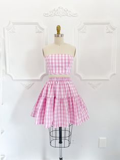 "The Petticoat Lane set is what summer outfit dreams are made of! Super limited edition pink gingham print inspired by everyone's favourite doll.  Skirt measures 18-20\" long from top of waistband depending on size. ♡ The Jordan de Ruiter collection is hand crafted in Canada in-studio & by small run manufacturers. Made to order, please see the shipping section for current turnaround on this item. Please choose the size that is closest to your measurements. If you are unsure please send your exac Pink Summer Dress With Gathered Skirt, Summer Pink Dress With Gathered Skirt, Spring Picnic Skirt With Ruffles, Gingham Skirt For Summer Picnic, Summer Gingham Skirt For Picnic, Fitted Cotton Skirt For Picnic, Fitted Gingham Skirt For Summer, Summer Gingham Dress With Tiered Skirt, Fitted Cotton Gingham Skirt