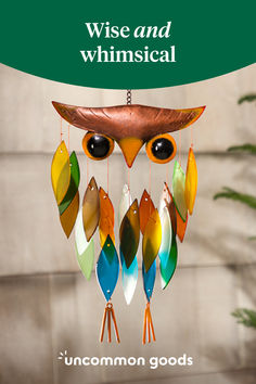 an owl mobile hanging from a tree with the caption wise and whimsical uncommon goods