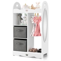 a white shelf with two drawers and some stuffed animals on the top one is next to a mirror