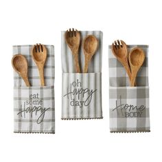 three wooden utensils in napkins that say happy today and eat some happy time