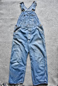 A pair of fantastic 60s vintage Lee Jelt Denim sanforized distressed workwear bib overalls. Union Made in USA. They are in nice vintage condition with the perfect amount of wear & tear creating a perfectly distressed & worn patina. It does have a few holes including one below one of the suspender buttons & one below the crotch so repairs might be required in time. There is a rectangular patch repair in the left knee & the tool pouch on the right side has been torn off. They are ready to wear! Pl Vintage Washed Cotton Jeans, Vintage Ripped Fitted Jeans, Vintage Fitted Ripped Jeans, Vintage Cotton Jeans Pre-washed, Vintage Pre-washed Cotton Jeans, Vintage Distressed Washed Blue Bottoms, Vintage Washed Blue Distressed Bottoms, Tool Pouch, 60s Vintage