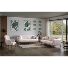 a living room filled with white furniture and wooden flooring next to a large window