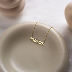 Dainty and stylish 14K gold necklace featuring lowercase "mama" in custom cursive font. Looks stunning whether worn alone or layered with other necklaces.  Give this stunning necklace to your mother as a Mother's Day gift and make her happy!  ✿ PRODUCT DETAILS ✿ * Materials: 14K Gold-Plated over 925 Sterling Silver or 14K Solid Gold (We only use the highest quality 14K Gold and 925 Sterling Silver) * Colors: Yellow Gold, Rose Gold, White Gold * Chain Lengths: 14", 16", 18", 20", 22" (All chains, New Mom Jewelry, Mom Gifts Jewelry, Minimalist Mom, Mom Pendant, Mommy Necklace, White Gold Chain, Cursive Font, White Gold Chains, Mom Jewelry