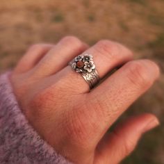 Add a touch of whimsy to your look with our Sterling Silver Floral Ring featuring a delicate floral design of cherry blossoms and leaves. The sunstone center adds an ethereal glow. Perfect for boho brides and lovers of all things rustic. Floral Ring, Boho Bride, Silver Band Ring, Ring Engagement, Cherry Blossoms, Boho Rings, Ring Necklace, Band Ring, Fall Colors