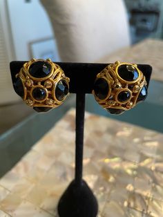 "Beautiful clip on style gold toned earrings with black and gold crystals.  Measure 1\" by 1\".  They are previously owned and in excellent vintage condition" Gold Crystals, Onyx Bead, Oct 30, Sterling Silver Cross, Silver Cross, Pave Diamonds, Vintage Leather, Black Onyx, Black And Gold