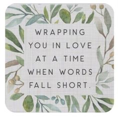 a square coaster with the words wrapping you in love at a time when words fall short