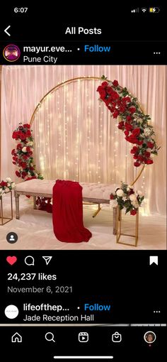 an instagram page with flowers and lights on the wall, and a red blanket draped over it