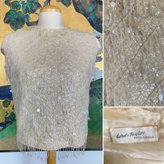 "This shimmering top would look fabulous paired with a fitted pencil skirt. Made of wool and fully lined, this beautiful top is absolutely dripping in sequins and beaded fringe! It zips closed at the back with a metal zipper. It is in good condition. There is some bead loss and some small holes on the inner lining area as seen in the photos.  Measurements were taken with the garment laid flat. I recommend comparing the provided measurements against a garment in your own closet that fits you well. Bust: 21.5\"-21\" Waist: 19\"-19.5\"  Length from top of shoulder to hem: 17.5\", not including fringe trim Please convo me with any questions. Thanks for looking!" Elegant Evening Tops With Beaded Fringe, Spring Fitted Top With Beaded Fringe, Spring Fitted Tops With Beaded Fringe, Fitted Beaded Fringe Tops For Evening, Glamorous Beaded Fringe Top For Night Out, Chic Silk Top With Sequins, Chic Silk Sequin Top, Glamorous Silk Top With Sequins, Glamorous Sequined Silk Top