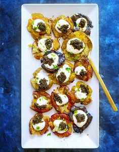 a white plate topped with different types of food on top of a blue tablecloth