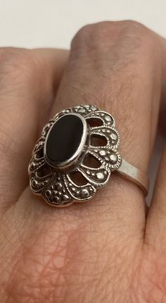 Vintage ring surrounded by Swiss cut fine marcasite and black onyx Sterling silver Size 6.75 can be sized by my jeweler. His service charge is $10-$20 All rings are shipped free in the US in a nice gift box. Check out our over a THOUSAND great reviews!!! Engraving is $4 per letter and is not always perfect depending on the piece. It can take a few days if the jeweler is busy. This is payable to Paypal Judithsltd@gmail.com Victorian Black Sterling Silver Rings, Victorian Style Black Sterling Silver Rings, Vintage Sterling Silver Ring With Black Enamel, Art Deco Silver Rings With Black Enamel, Vintage Sterling Silver Rings With Black Enamel, Vintage Black Oval Filigree Ring, Black Oval Filigree Ring, Black Sterling Silver Filigree Ring As A Gift, Black Sterling Silver Vintage Rings