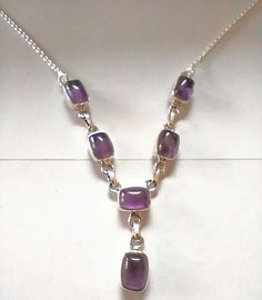 Exclusive Amethyst necklace handmade by artisans from India. Exquisite Amethyst set in sterling silver connected with a sterling silver rolo chains.length 20 inches adjustable to 18 inches.weight 9.8 grams Silver Amethyst Necklace With Cabochon, Silver Amethyst Cabochon Necklace, Amethyst Purple Necklaces Stamped 925, Nickel Free Purple Sterling Silver Necklace, Purple Amethyst Necklaces Stamped 925, Nickel-free Purple Sterling Silver Necklace, Purple Sterling Silver Jewelry With Adjustable Chain, Amethyst Cabochon Necklace For Gift, Silver Amethyst Necklace With Adjustable Chain