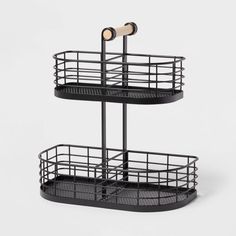 two tiered metal basket with wheels on each side