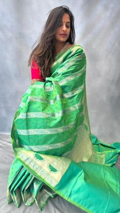 Inspired by ancient Mughal architecture, this beautiful dual tone pure mashru silk saree has intricate gold zari weaving in mehrab pattern and has small buttis in blue contrast colour all over the body. Blouse: parrot green pure mashru silk material [Unstitched] Festive Green Pre-draped Saree With Zari Weaving, Green Dola Silk Pre-draped Saree For Diwali, Green Pre-draped Saree With Zari Weaving For Diwali, Green Paithani Silk Pre-draped Saree With Self Design, Green Chanderi Pre-draped Saree For Puja, Green Pre-draped Saree With Self Design For Diwali, Green Tussar Silk Pre-draped Saree With Dupatta, Festive Green Paithani Silk Pre-draped Saree, Green Dola Silk Saree With Zari Work