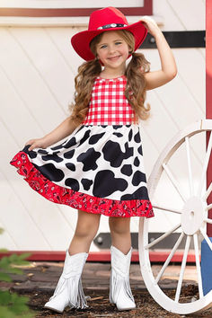 We're bringing fabulous fashion to the rodeo with our cow print ruffle dress. Dressed up with a mix of fun patterns and playful ruffles, this showstopper makes a sassy statement. Your little cowgirl will turn into a rodeo star! Playful Ruffled Dresses For Fall, Playful Fitted Dress For Fall, Playful Fitted Dress With Ruffle Hem, Fun Summer Dress With Ruffle Hem, Fun Fitted Ruffle Dresses, Rodeo Cowgirl, Fun Patterns, Night Light Kids, Fabulous Fashion