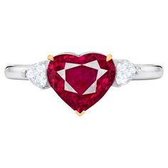 our breathtaking GIA certified 2 carat heart-shaped vivid red corundum ruby cocktail ring. Crafted with precision and passion, this masterpiece is nestled in solid 18k white and yellow gold, exuding timeless beauty. At its center, a mesmerizing heart-shaped ruby steals the spotlight with its unparalleled brilliance. This transparent red gem, untouched by any treatment, radiates with a vivid hue, captivating all who gaze upon it. Flanking this majestic ruby are two pear-cut diamonds, each a testa Pear Diamond Ring, Sapphire Cocktail Ring, Pear Diamond Rings, Sapphire Solitaire Ring, Pear Ring, Ruby Diamond Rings, Pear Cut Diamond, Diamond Cocktail Rings, Shiny Things