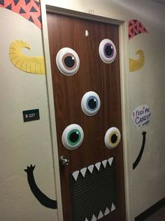 a door decorated to look like a monster with big eyes and large mouthy mouths