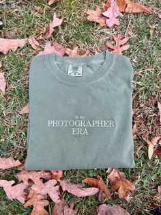 Made to order embroidered comfort colors t shirt! Perfect for your fave photographer! Message me for other color options! Sweatshirts are Jerzees/ Gildan brand and UNISEX sizing. Size up for an oversized fit! **Machine wash COLD and hang dry to extend embroidery life** Shirts are made to order so processing time is 3-7 business days. Please message me if you need your order sooner, and I will do everything I can to get it to you ASAP! Message me for any custom orders! T Shirt Branding Photoshoot, Photography Business Shirt, Photographer Merch Ideas, Clothes Photography Ideas Diy Photo, T Shirt Business Photoshoot Ideas, Photography Merchandise Ideas, Shirt Picture Ideas, Business Shirt Ideas, Tshirt Photoshoot Ideas Products