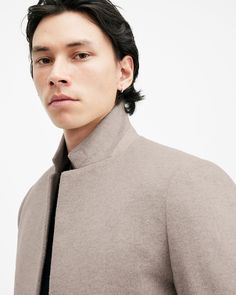 The coat of the season is here. This is the Hargrove Coat. It's constructed using a recycled wool-blend fabric that's brushed for a soft texture. The tailored shape is cut to a slim-fitting silhouette that features a smart lapel and standing notch collar that defines the shape. Complete with conscious corozo buttons and suede under the collar – it's all in the details.   This coat is designed to a slim fit Button closure Long sleeves Standing notch collar Lapel Suede under collar Two flap pockets One button fastening Soft brushed cloth Conscious corozo buttons Leather hanging loop Recycled fabrics