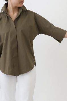 Features three-quarter length relaxed dolman sleeves, wide cuff details, a classic collar, a covered button placket, and a soft curved hem. This lightweight cotton blouse will be your go-to for the throw-on, casual look and is easily styled with a heeled shoe or elevated accessory for a night out. The Sahana Shirt is fabricated in our best-selling Premium Italian Cotton shirting that is crisp yet breathable, soft yet beautifully structured. Shirting that lasts a lifetime and is never transparent. size guide and fit designed for a relaxed fit and rounded underarm sleeve detail fits true to size Jarbo Size Guide Length Chest S (US 2-4) 27 1/2" 46 3/4" M (US 6-8) 28 1/4" 48 5/8" L (US 10-12) 29" 51 1/2" XL (US 14-16/18) 30" 56 5/8" *Measured Flat JPC553632 DOLMAN SHIRT Dolman Sleeve Shirt, Dolman Shirt, Italian Shirts, Fashion Journal, Organza Shirt, Fashion Journals, Blouse Pants, Wide Cuff, Silk Organza