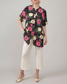 Introducing a stunning vintage 100% silk shirt for women in size S. This short-sleeve summer blouse features a vibrant floral print, perfect for adding a splash of color to your everyday wear or garden party outfits.  Made from pure, high-quality silk, this blouse is exceptionally lightweight and airy, ensuring you stay comfortable and stylish.  It features a relaxed fit, hip length cut with side slits and lovely golden metallic buttons. Looking for a thoughtful, sustainable gift for a friend wh Relaxed Fit Floral Print Button-up Blouse, Collared Hawaiian Shirt With Floral Print For Summer, Multicolor Short Sleeve Shirt For Spring Vacation, Summer Multicolor Floral Print Short Sleeve Shirt, Spring Summer Short Sleeve Shirt, Multicolor Floral Print Short Sleeve Shirt For Summer, Multicolor Hawaiian Shirt For Spring, Casual Short Sleeve Blouse For Summer, Silk Collared Printed Tops