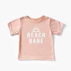 This super soft t-shirt is the perfect addition to your little beach babe's wardrobe this summer! It's comfortable, trendy and fun - also a really great gift for friends and family matching. Wear it on vacation, the beach, the pool, etc! Comes in a variety of beautiful and soft colors. A super cute birthday gift. Comes in baby sizes, toddler sizes and youth sizes! Beach Babe Kids t-shirt, summer, baby beach, toddler beach, girls shirt, beach t-shirt, summer vibes, mermaid, custom ----WASHING INS Summer Family Matching Short Sleeve Tops, Family Matching Short Sleeve Summer T-shirt, Summer Short Sleeve Tops For Family Matching, Summer Family Matching Relaxed Fit T-shirt, Family Matching Relaxed Fit T-shirt For Summer, Unisex Summer T-shirt With Crew Neck, Unisex Summer Crew Neck T-shirt, Unisex Crew Neck T-shirt For Summer, Cute Custom Print Summer T-shirt