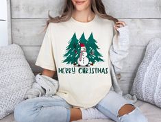 Snowman Sweatshirt, Christmas Sweatshirt, Snowman Tee, Snowman T-Shirt, Christmas Sweater, Christmas Shirts for Women,Tree Christmas Sweater. Embrace the winter wonderland with our Snowman Sweatshirt! This Christmas-themed sweatshirt is the perfect addition to your holiday wardrobe. Whether you're attending festive gatherings or spreading cheer. Share the joy of the season with our Snowman Sweatshirt and let the holiday spirit melt your heart. The 100% cotton men's classic tee will help you land a more structured look. It sits nicely, maintains sharp lines around the edges, and goes perfectly with layered streetwear outfits. Plus, it's extra trendy now!   * 100% cotton  * Sport Grey is 90% cotton, 10% polyester  * Ash Grey is 99% cotton, 1% polyester  * Heather colors are 50% cotton, 50% p Relaxed Fit Crew Neck T-shirt For Christmas, White Relaxed Fit Christmas T-shirt, White Relaxed Fit T-shirt For Christmas, Relaxed Fit Christmas T-shirt For Holiday, Snowman Sweatshirt, Women Tree, Christmas Shirts For Women, Holiday Wardrobe, Sweatshirt Christmas