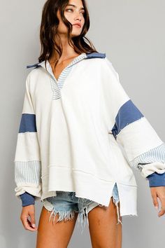 This French terry knit top is a great addition for your wardrobe, especially for those who are seeking comfort and style. It features a big collar, Henley style, and long dolman sleeves. The ivory and blue color block adds a pop of color, giving off the perfect laidback vibes. Pair it with distressed shorts or blue jeans for a casual, yet refined look. Features: Raw edge details, French terry knit, big collar, Henley style, long dolman sleeves, contrast color block details Fit: Oversized, loose Winter Outfits Coastal, Big Collar, Loose Fitting Tops, Pullover Designs, Block Design, Christmas Wishlist, Raw Edge, Christmas List, Tunic Top