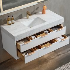 a bathroom vanity with drawers and a sink